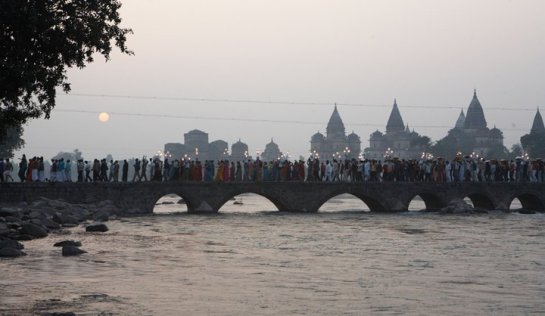 A religious procession crossing the bridge over River Betwa